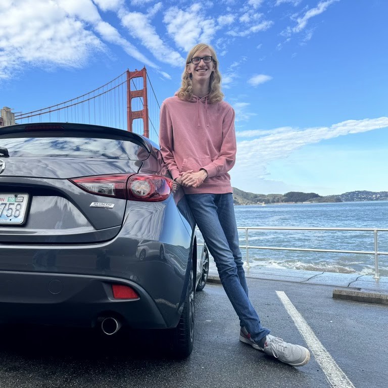 Roman Garms posing in front of the golden gate bridge